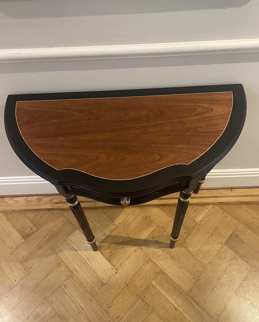 Overhead view of the demi-lune top in original wood veneer