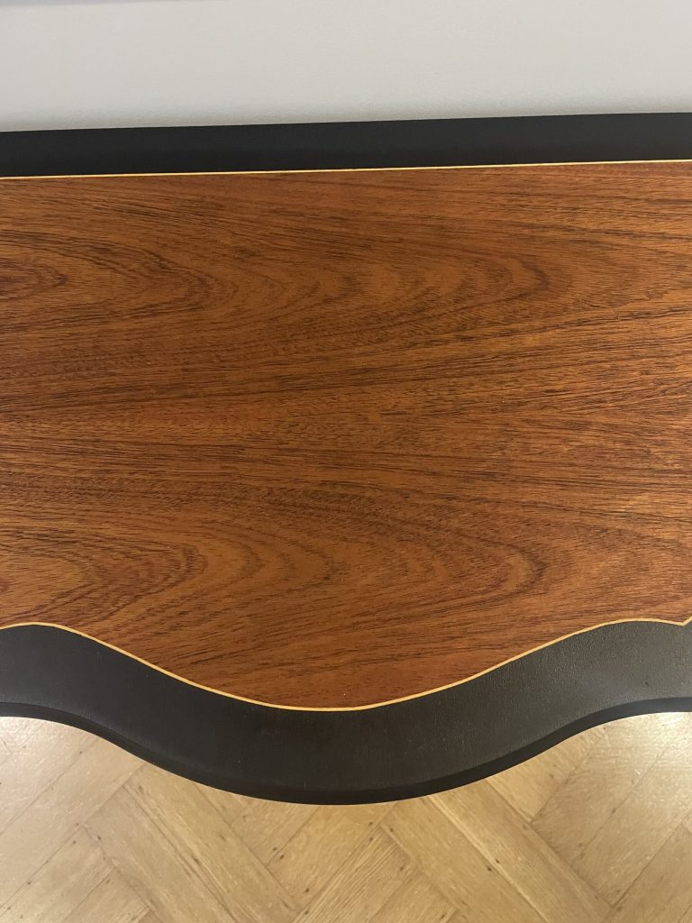 Close view of the lighter inlaid border against the Coal Black surround